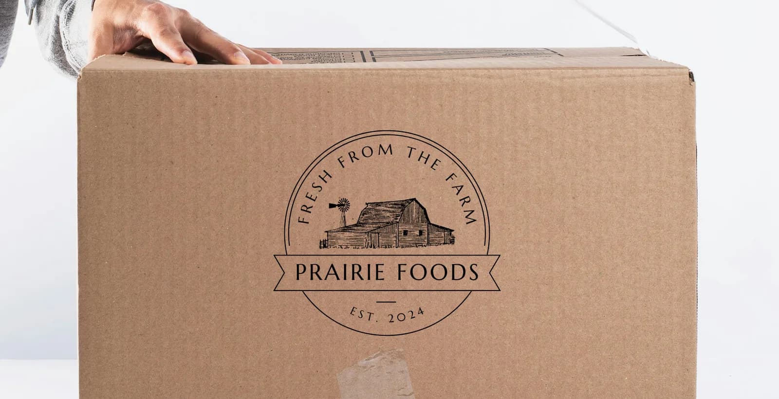 The Prairie Foods logo printed on a shipping box